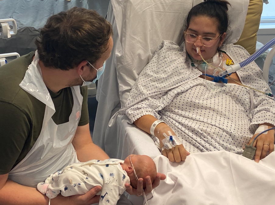 Chelsie (seen with her husband) meeting her son for the first time when he was almost six weeks old